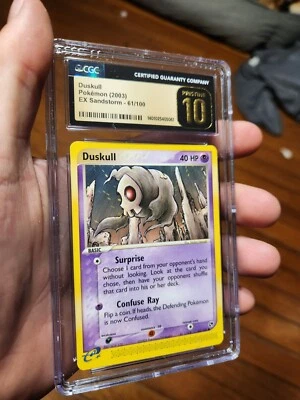 (Pop 3) CGC 10 PRISTINE Pokemon Ex Sandstorm 2003 Duskull 61/100 Card  - Image 1 of 4