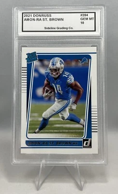 Tarjeta de novato Amon-Ra St. Brown calificada 10 gemas como nueva 2021 Donruss clasificación Rookie radiocontrol Foto 1 de 3