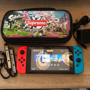 Nintendo switch handheld game with charger and case - Picture 1 of 6