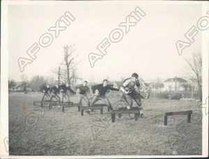 1930 Northwestern Wildcats Football Practice on Low Hurdles Press Photo - Picture 1 of 2