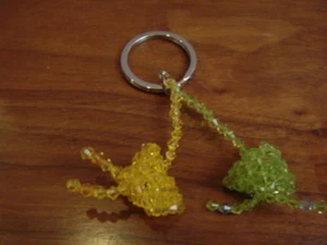 LLAVERO DE CUENTAS ACRÍLICAS HECHAS A MANO CORREA arroz albóndigas - Imagen 1 de 1