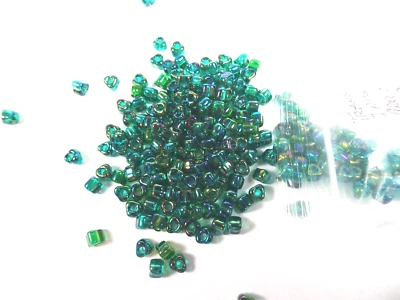 125 Miyuki Transparent AB Iris MEDIUM GREEN Glass TRIANGLE BEADS - Image 1 of 2