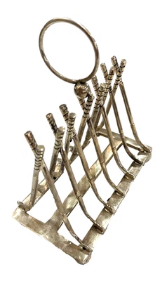 Palos de golf cruzados vintage plateados con soporte para tostadas del siglo XX Foto 1 de 4