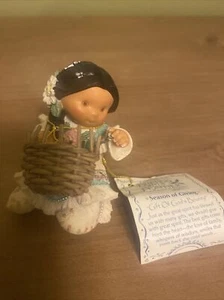Enesco Friends of the Feather “Season of Giving” Girl. - Picture 1 of 11