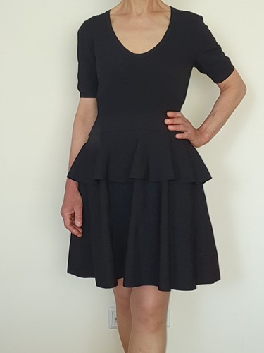 Abito in peplum nero MOSCHINO taglia UK12 IT44 M L maglia elasticizzata (ottimo condimento)