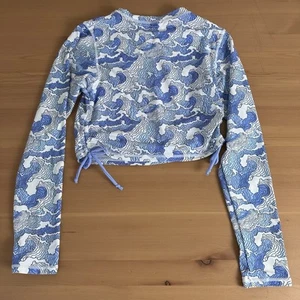 Camisa de natación con volantes traseros para niñas 16 olas azules manga larga protección solar camiseta de natación - Imagen 1 de 5