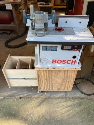 Bosch 1617EVS Router and Bosch RA1171 Professional Router Table Plywood Cabinet - Image 1 of 4