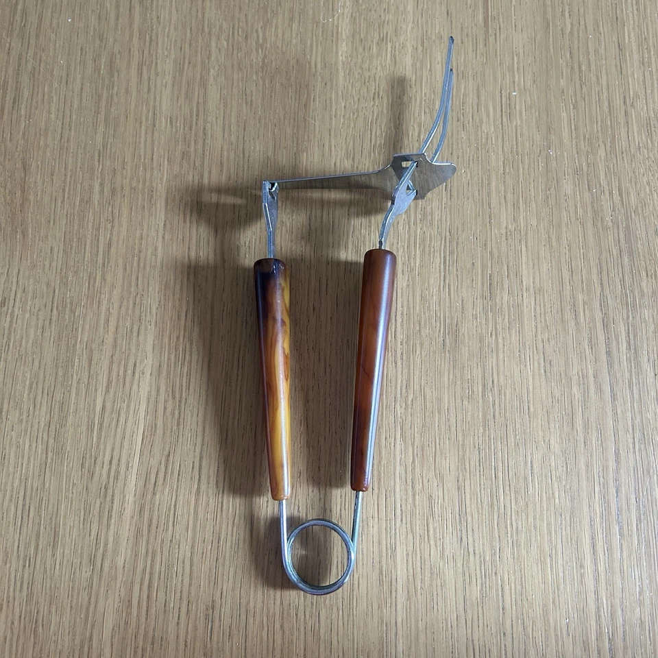 Vintage Bakelite Servette Hinged Sliding Serving Fork Tortoise Shell Design MCM - Image 1 of 4