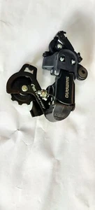 Deragliatore posteriore Shimano SIS Tourney RD-FT35A gabbia corta attacco gancio 6/7 velocità - Foto 1 di 4