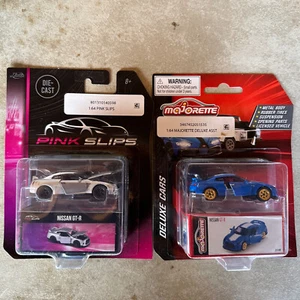 '03 JUEGO DE 2 PUERTAS PLATEADAS Y AZULES 1:64 APERTURA DE CALZONCILLOS ROSA NISSAN GT-R Jada Toys '03 - Imagen 1 de 10
