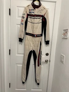 ROMAIN DUMAS, SIGNED, 2009 PORSCHE MOTORSPORTS RACE USED/WORN,DRIVERS SUIT, HAT - Picture 1 of 11