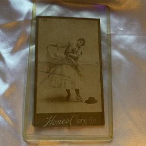 1880's Duke Tobacco Card Honest Long Cut BEAUTIFUL Dancing WOMAN  4” X 2 1/2” - Afbeelding 1 van 9