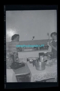 black and white negative - women in the kitchen washing dishes - Picture 1 of 3