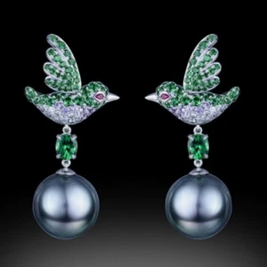PRECIOSOS PENDIENTES FORMA PASARO CON CRISTAL VERDE Y PIERLA DE IMITACIÓN GRÍS - Imagen 1 de 5