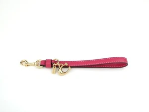 Coach rosa Leder Armband mit goldfarbenen Hardware & charakteristischem Anhänger - Bild 1 von 4