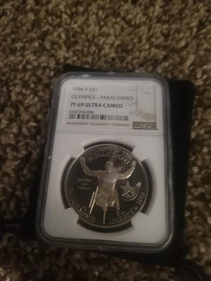 1996-P Olympics Paralympics $1 NGC PF 69 UCAM Modern Commemorative Silver - Image 1 of 2