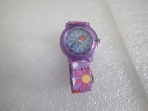 ACCUTIME LILA BLUME JAPAN UHRWERK GESCHENK *BRAUCHT BATTERIE* - Bild 1 von 4