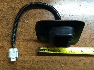 NEW OEM 2005-2006 NISSAN FRONTIER REAR LICENSE LAMP ASSEMBLY - ONE SIDE ONLY - Picture 1 of 6