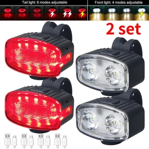 Set 4 pezzi illuminazione bicicletta LED batteria USB luce ruota anteriore posteriore luce DE - Foto 1 di 14