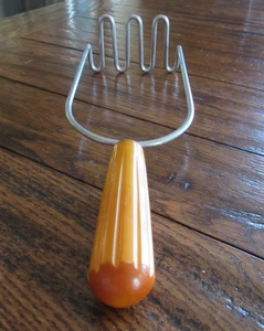 VTG Androck Stainless Steel Butterscotch Catalin Bakelite Handle Potato Masher - Picture 1 of 7