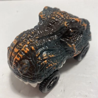 Vehículo con cabeza de dinosaurio T-Rex se ilumina y se convierte en autopropulsado funciona 3-1/2" Foto 1 de 4