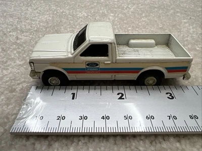 ERTL Metal 90’s Ford F-150 White New Holland Pick Up Truck. 1/64 Scale  - Image 1 of 4
