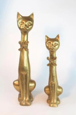 MID CENTURY REGENCY BRASS FELINE POISED CATS WITH FLORAL BOW TIE AND RAISED TAIL - Image 1 of 4