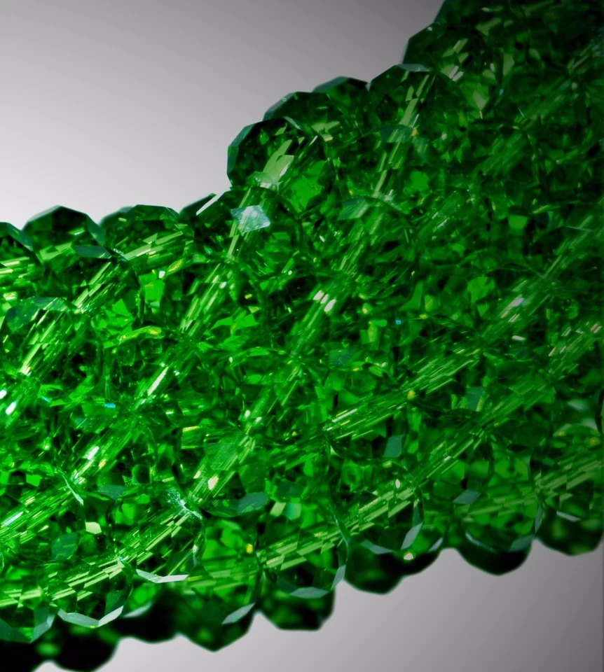 a string of AAA dark green faceted glass crystal rondelle beads, of 8 & 10 mm - Image 1 of 1