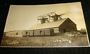 RPPC - Lime Kiln Building & Railroad Train boxcars, Leroy Minnesota Postcard - Picture 1 of 2