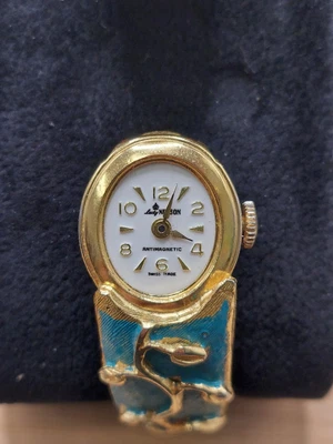 Reloj mecánico Lady Nelson vintage dorado esmaltado turquesa Foto 1 de 4