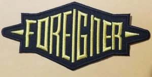 Embroidered FOREIGNER Rock Band Gold-Yellow Patch approx 2.25x4.75" Iron or sew - Picture 1 of 2