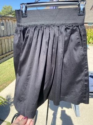 Falda plisada negra INC International Concepts cremallera trasera y bolsillos talla 4 Foto 1 de 4