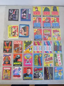 LOT OF 40 VINTAGE EMPTY CARD WRAPPERS STAR WARS MOTU ET DUNE RAMBO GOONIES ETC - Picture 1 of 4