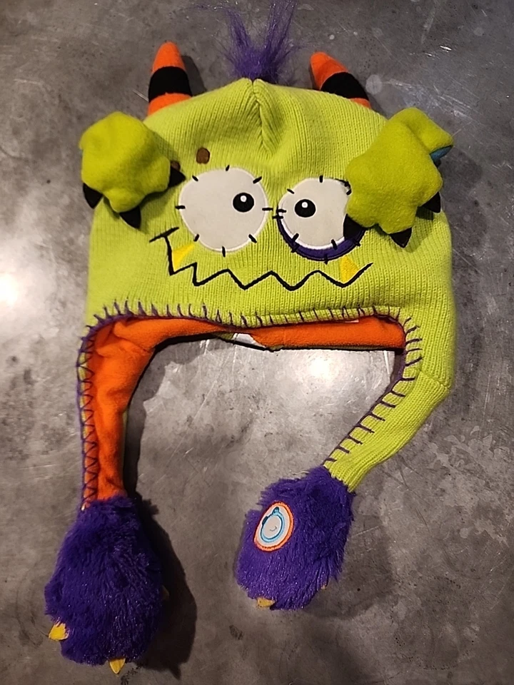 Sombrero verde Flipeez Peek-a-Boo Monster con brazos móviles  Foto 1 de 4