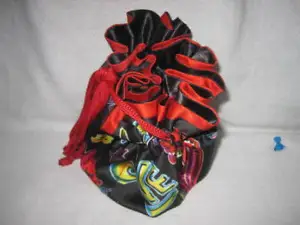 Multicolored Black w/ red trimmed Drawstring Pouch EUC - Picture 1 of 8