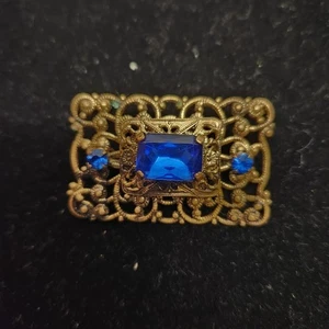 Spilla vintage ceca in ottone e vetro blu - Foto 1 di 6