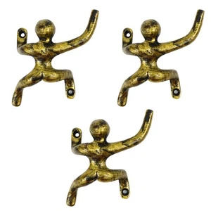 Set 3 ganci appendiabiti uomo in ghisa design arrampicata decorazione arte parete-design antico - Foto 1 di 6