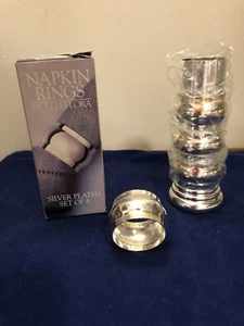 Juego de 4 anillos de servilleta de placa de plata Teleflora con soporte decorativo nuevos en caja - Imagen 1 de 5