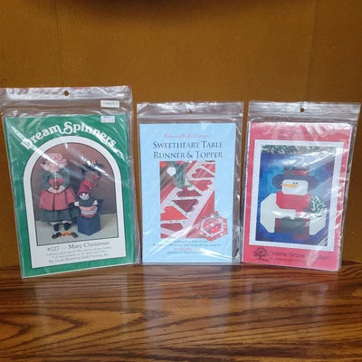 Lot of 3 New Uncut DIY Crafters Patterns: Quilt, Table Runner, Mrs Santa Doll - Image 1 of 4