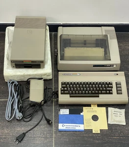 Ordinateur personnel Commodore vintage C64, imprimante matricielle, lecteur de disquettes et alimentation - Photo 1/24