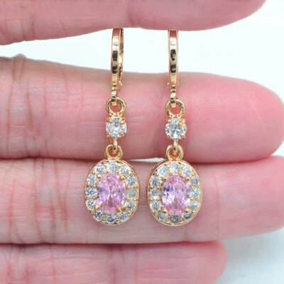 Pendientes colgantes de topacio místico azul lago ovalados rellenos de oro amarillo de 18 quilates de moda Foto 1 de 3