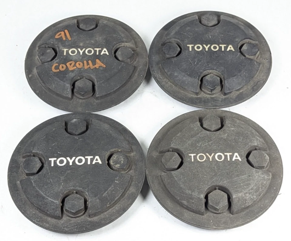 Juego de 4 tapas centrales negras Toyota Corolla Tercel 1986-1992 716814 OEM originales Foto 1 de 4