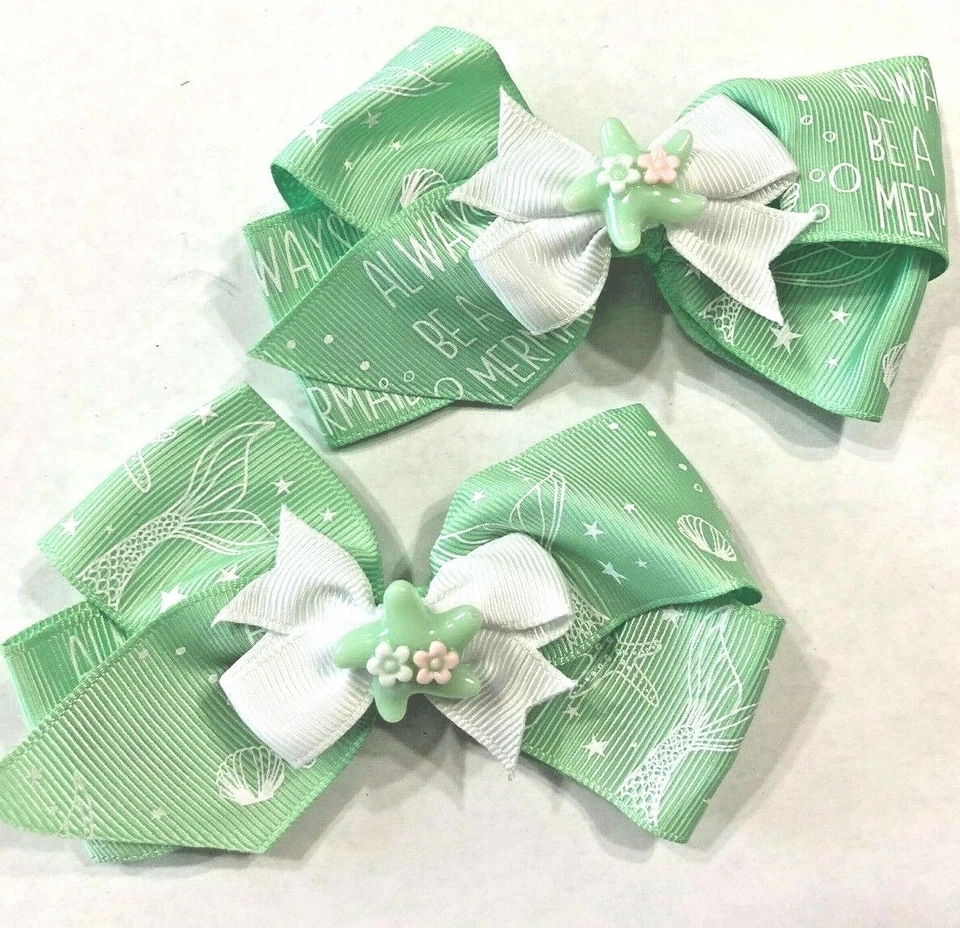 Hermoso conjunto de lazos de pelo de cola de cerdo inspirados en estrellas de mar verdes para niñas. Foto 1 de 3