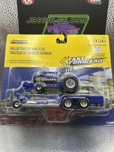 Tomy ERTL 1/64 New Holland "Fast Forward" Pulling Tractor with Sled 47574 - Picture 1 of 1