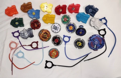 Lot of 9 Beyblades + 11 Launchers + XTS Extreme Top System Electro Pegasus X-53 Cover