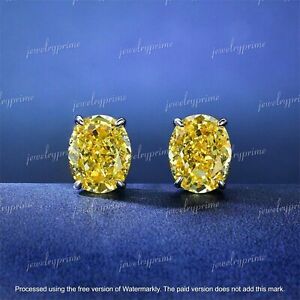 4Ct Oval Created Yellow Diamond Solitaire Stud Earrings In 14K White Gold Over