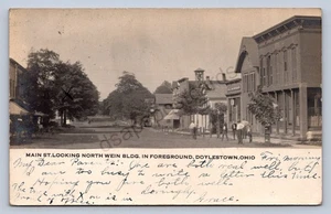 J87/ Doylestown Ohio RPPC Postcard c1910 Main St Stores Wein Building 1872 - Picture 1 of 4