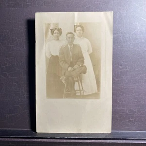 RPPC antique photo Postcard Family Portrait Man Woman Young Girl - Picture 1 of 4