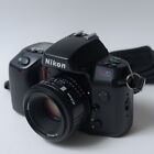 Appareil photo reflex argentique 35 mm Nikon N70 avec objectif 50 mm f1,8 + objectif 28-200 mm f3,8