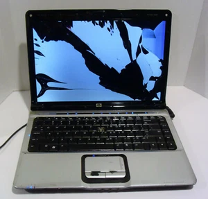 HP Pavilion dv2313cl 14.1in. (AMD Turion 64 X2, 1.8GHz, 1GB) - Cracked - AS IS - Picture 1 of 9